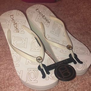 Bebe wedge flip flops